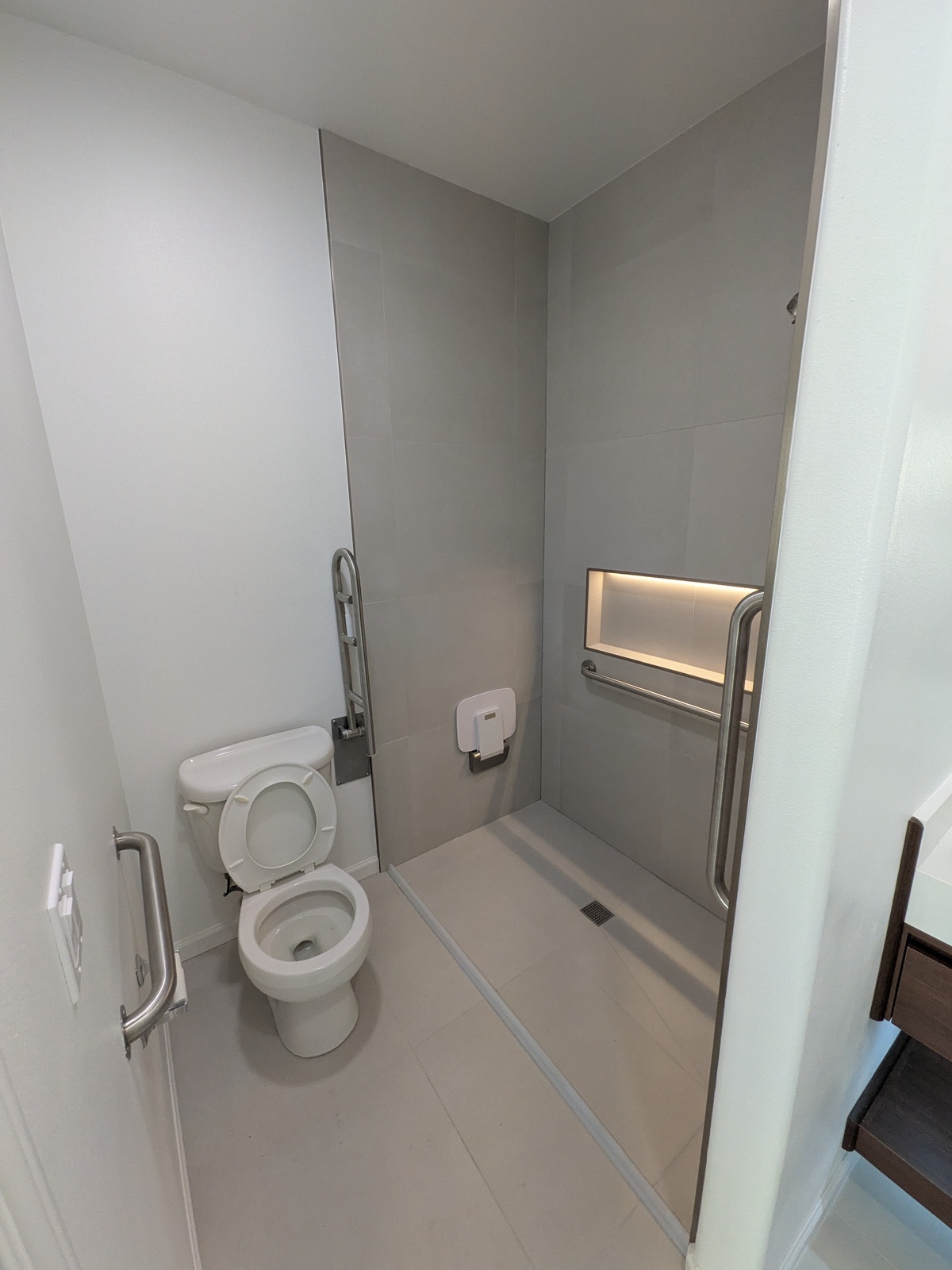Walk-in shower with accessible design at Edmonds Villa — safe bathing for elderly residents