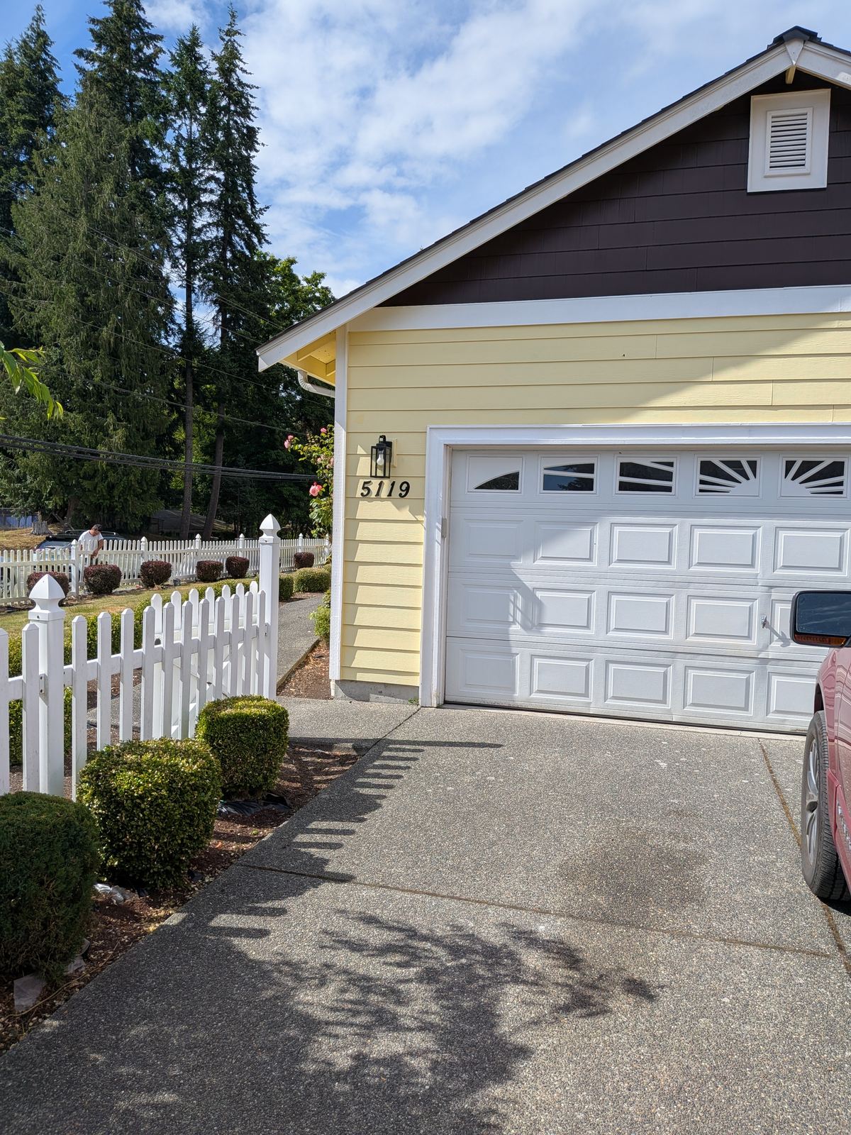 Garage and driveway with property address signage at Edmonds Villa adult family home