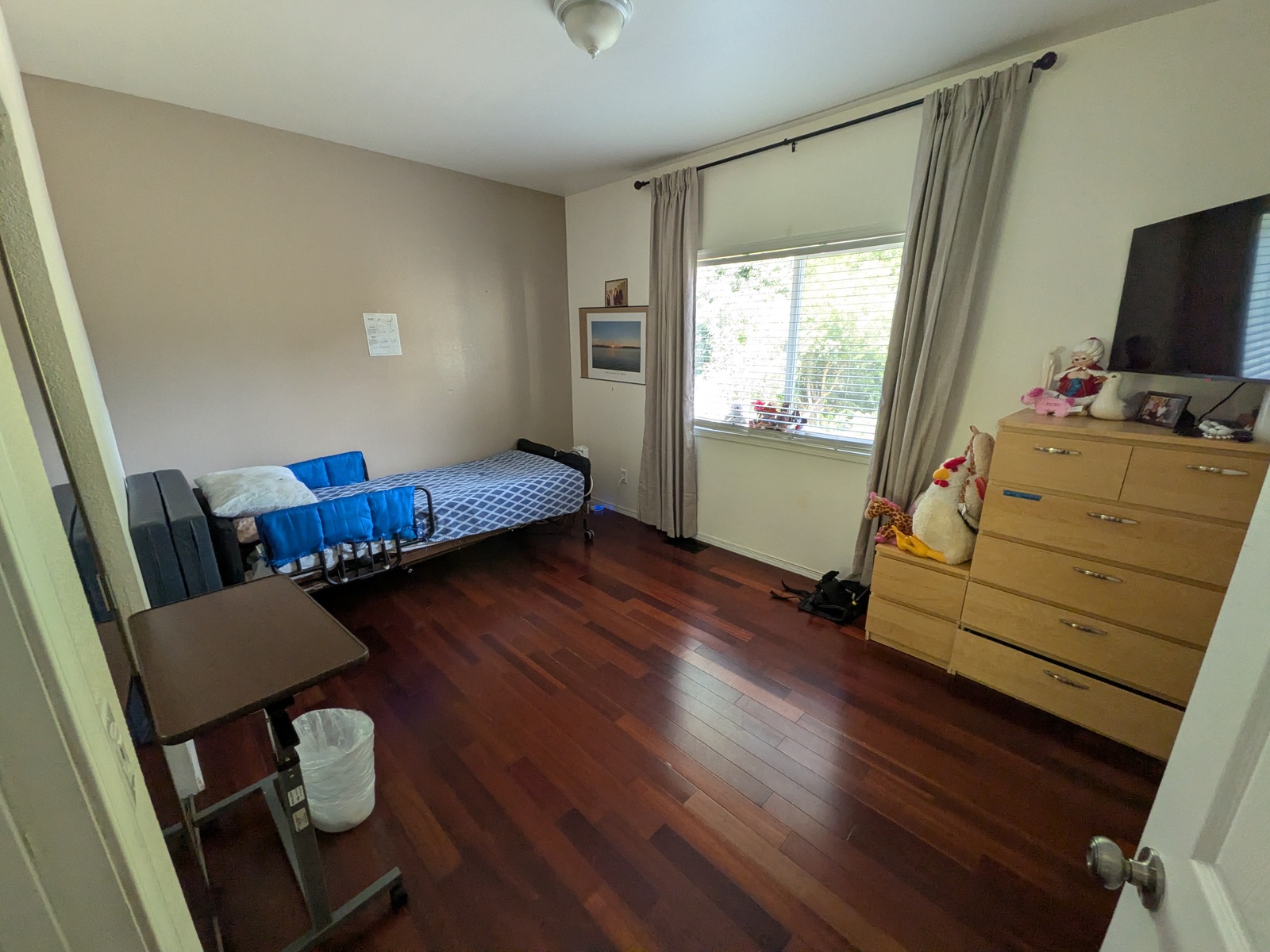 Private bedroom with adjustable hospital bed at Edmonds Villa — high-acuity care in home setting