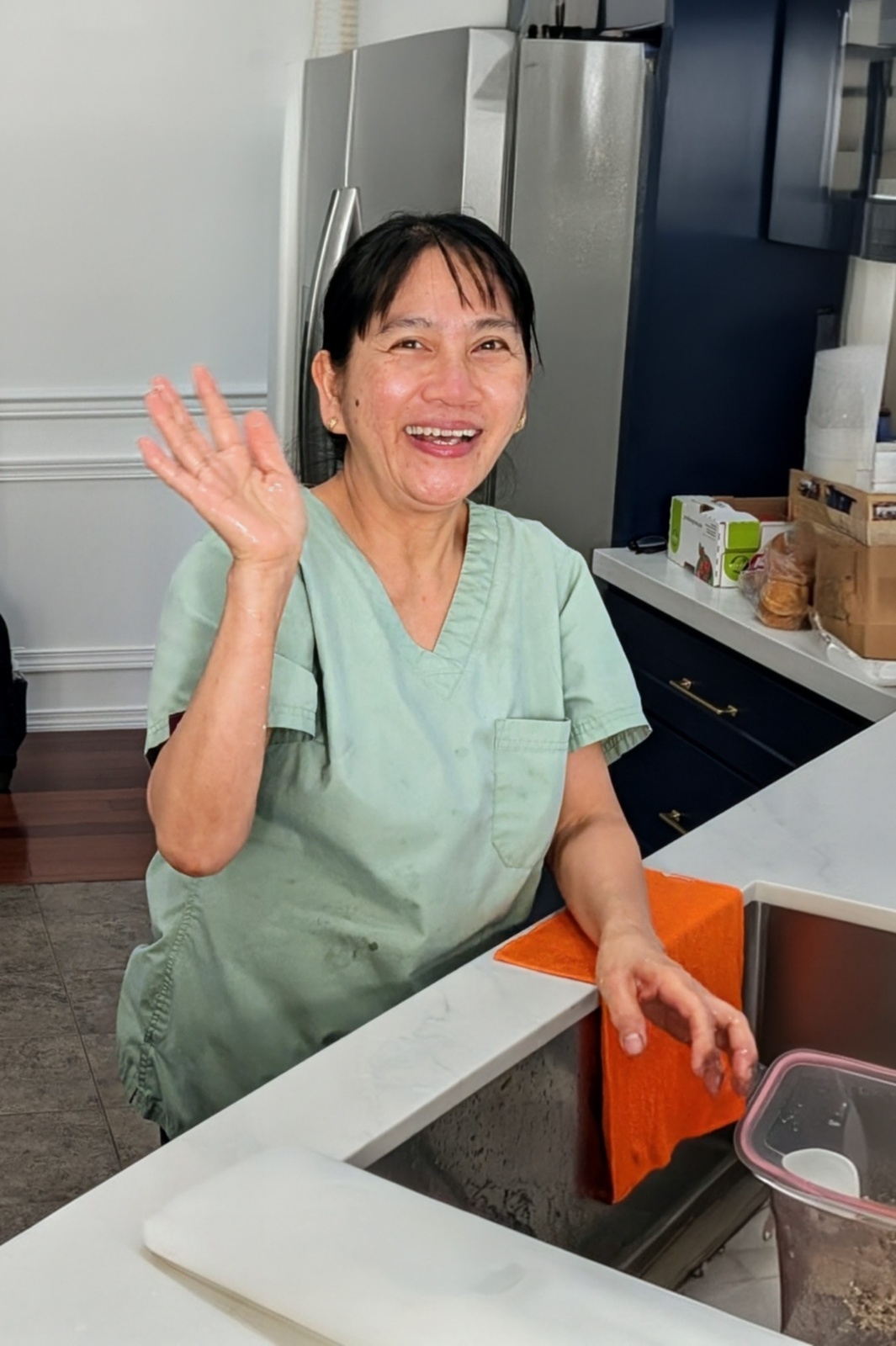 Dedicated caregiver preparing fresh meals in kitchen at Edmonds Villa adult family home