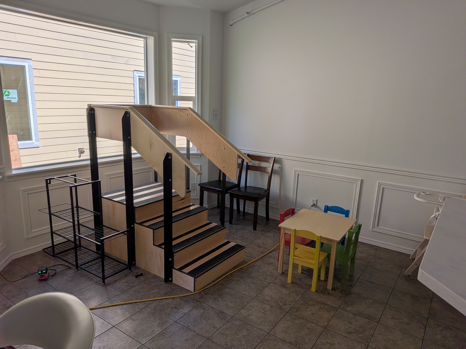 Children's play area with stairs and table at Edmonds Villa — welcoming space for visiting families