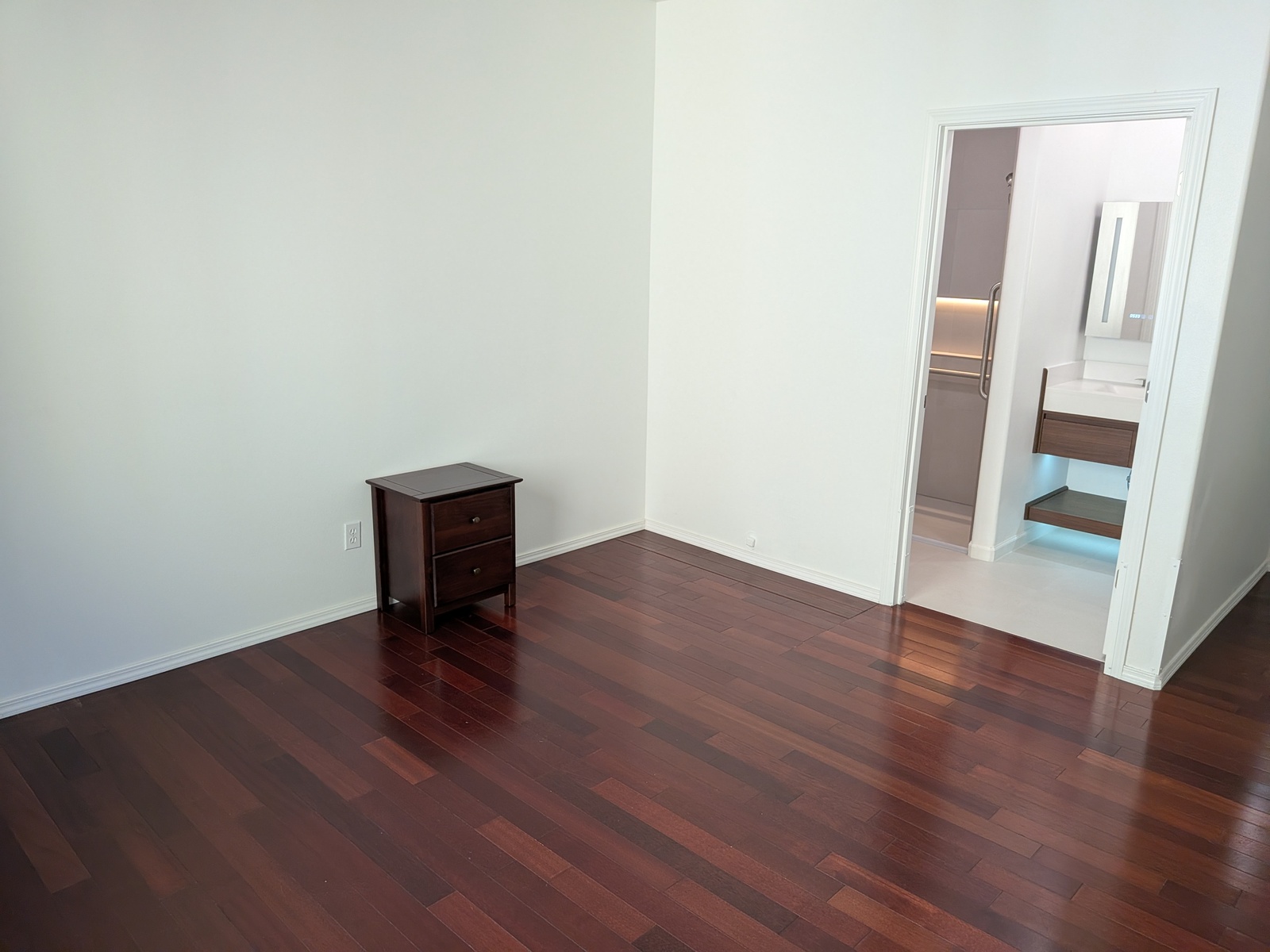 Warm and inviting private bedroom at Edmonds Villa adult family home with ensuite bathroom access