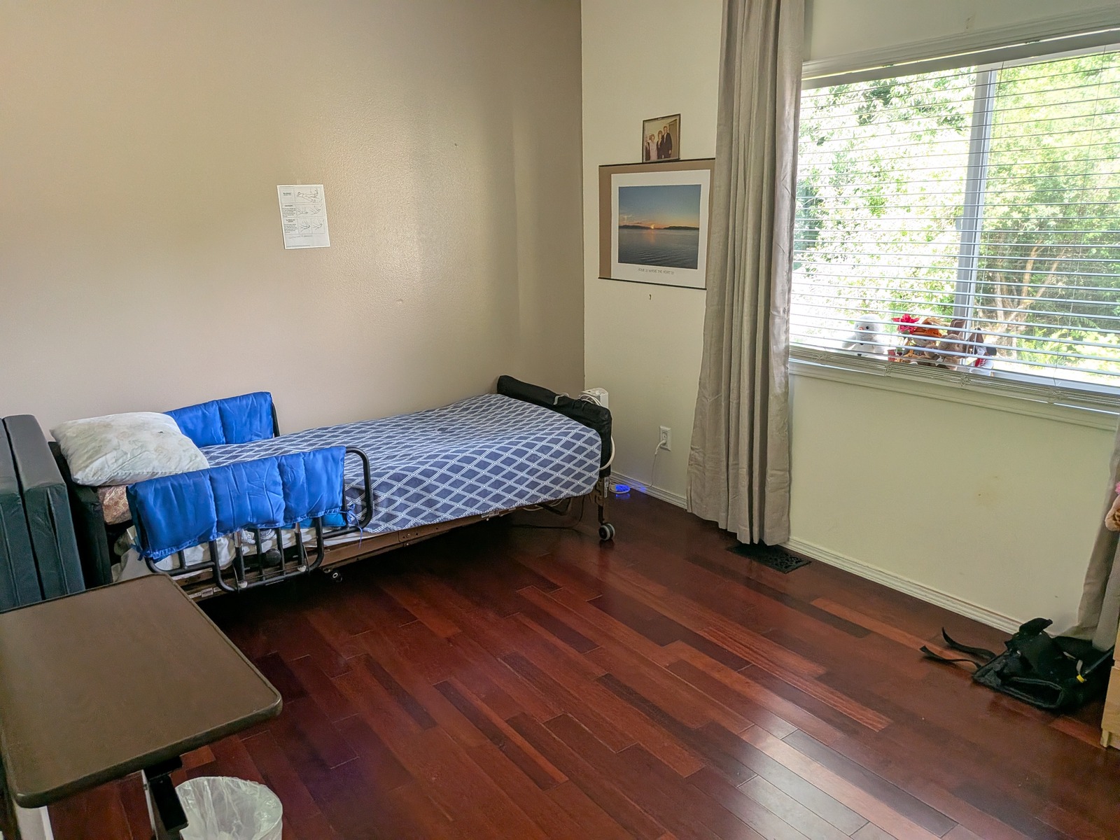 Decorated private bedroom with calming blue bedding at Edmonds Villa adult family home